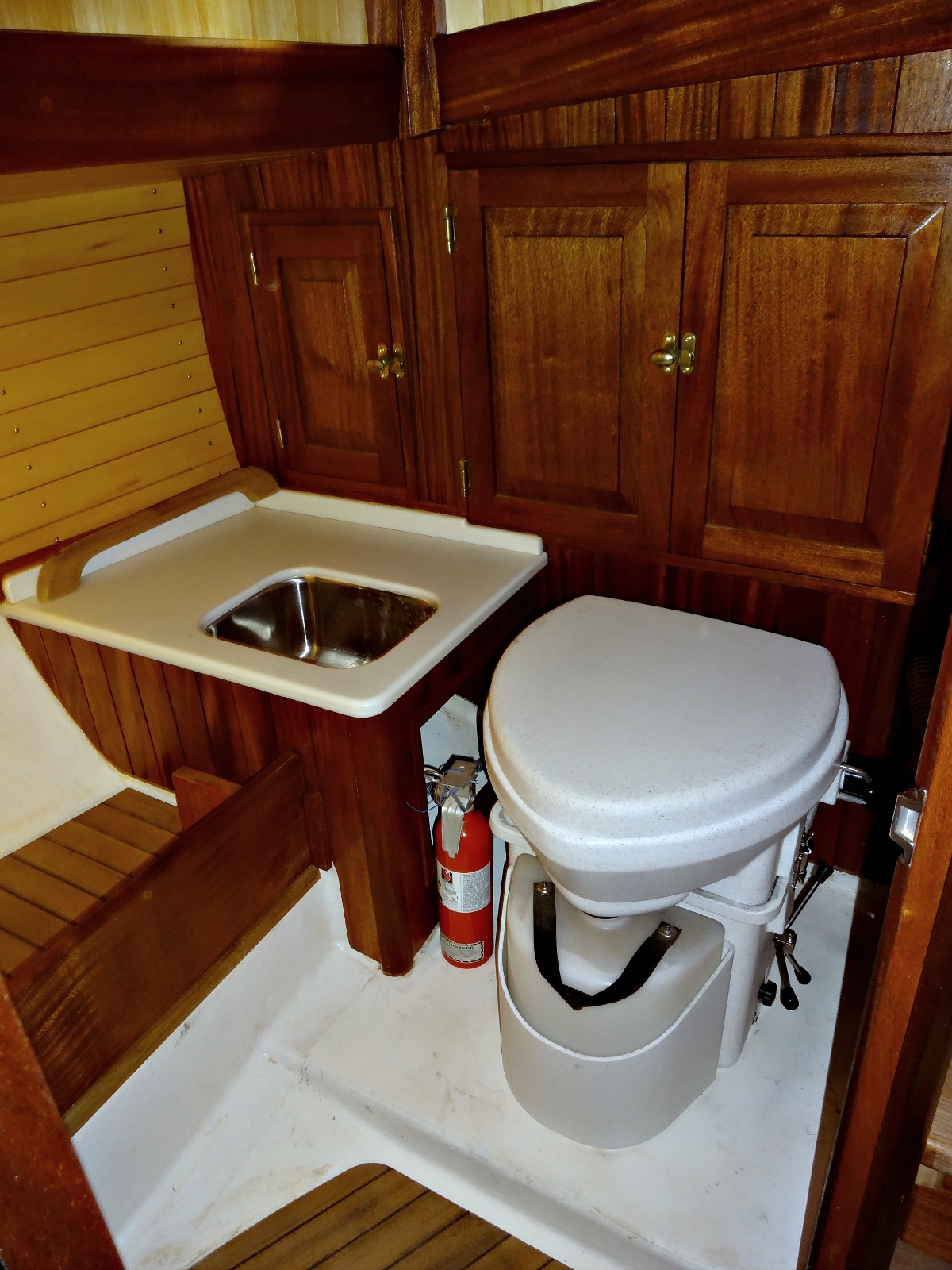 Natures Head marine composting toilet with foot spider handle